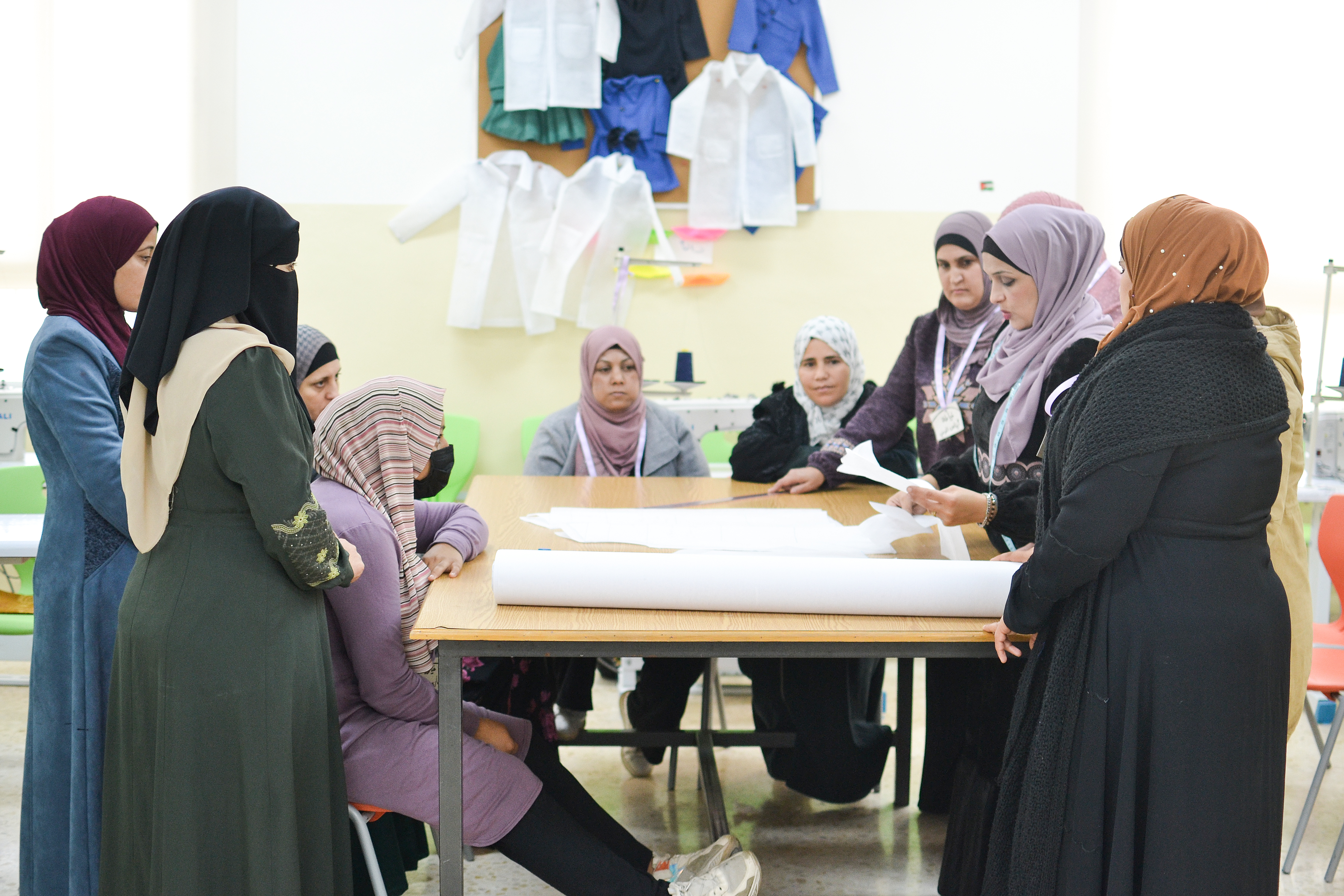 Najwa and her students during a Tailoring class at the UN Women Oasis centre in Ajloun, Jordan. Photo: UN Women/Bashar Al-Jabari 