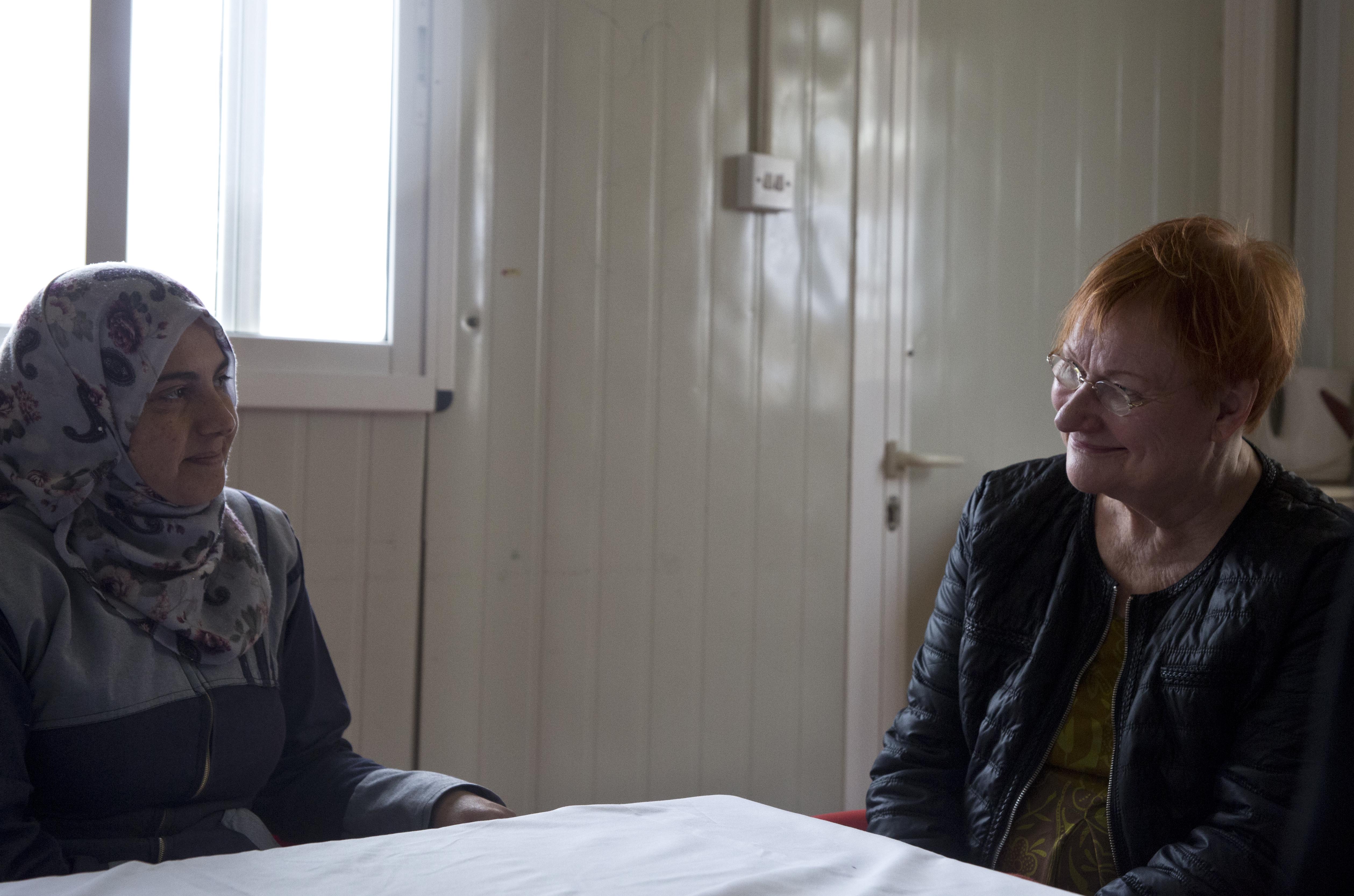 Tarja Halonen speaks to the women that work within the Oasis after her tour. 
