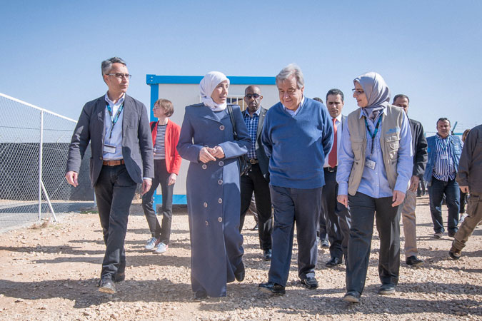 UN Secretary-General António Guterres arrives at the UN Women center in the Za’atari refugee camp and is welcomed by Ibtisam Majareesh, head of the camp women’s committee and member of the camp refugee committee, Ziad Sheikh, UN Women Jordan Representative, and Heba Zayyan, Recovery Specialist at UN Women Jordan. Photo: UN Women/ Benoît Almeras