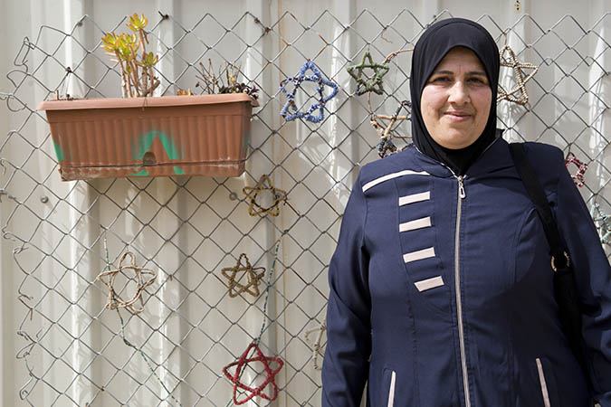 Maha Aasi Emm Ala’a, 48, Syrian refugee woman enrolled in the UN Women’s cash-for-work programme as tailor in the ‘Oasis Center for Resilience and Empowerment of Women and Girls’ operated by UN Women in the Za’atari refugee camp. Credits: UN Women/Lauren Rooney