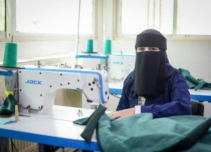 Nedaa during the tailoring class at Al-Muwaqqar Oasis Centre. 
