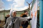 Senior Camp Assistant, Rawan Majali commemorates the opening ceremony with her hand print pledge to show her support for the 16 Days of Activism Against Gender-Based Violence campaign, in Za’atari refugee camp.Photo credit: UN Women/ Lauren Rooney